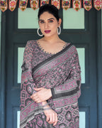 Black Pure Cotton Linen Saree with Pink Striped Pallu and Tassel Accents