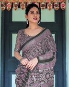 Black Pure Cotton Linen Saree with Pink Striped Pallu and Tassel Accents