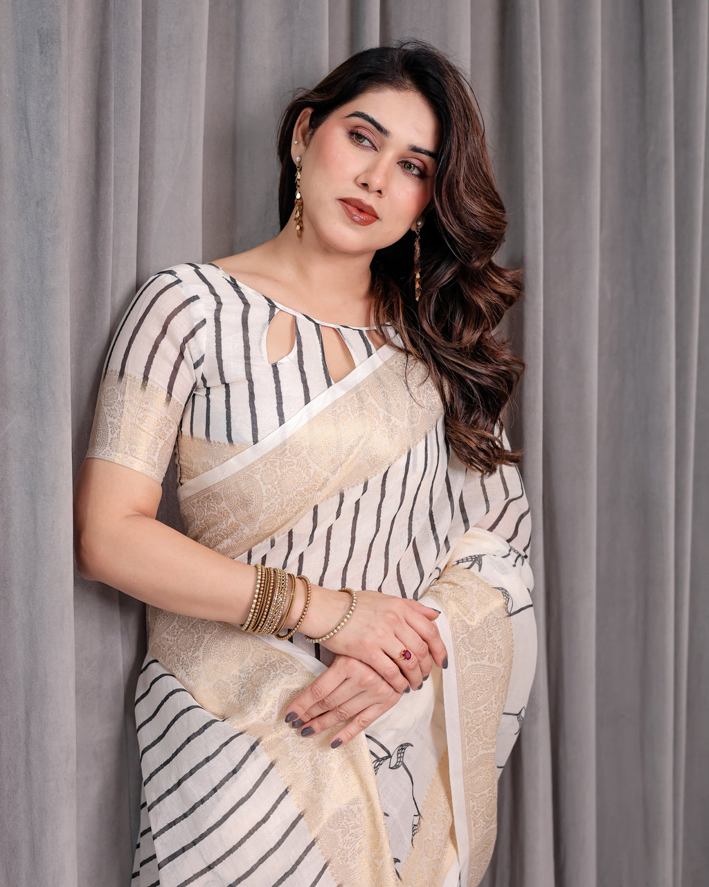 Off-White Handloom Linen Saree with Black Vertical Stripes & Tribal Motifs | Golden Zari Border & Tassel Pallu | Attached Blouse | 5.5m Saree + 0.8m Blouse