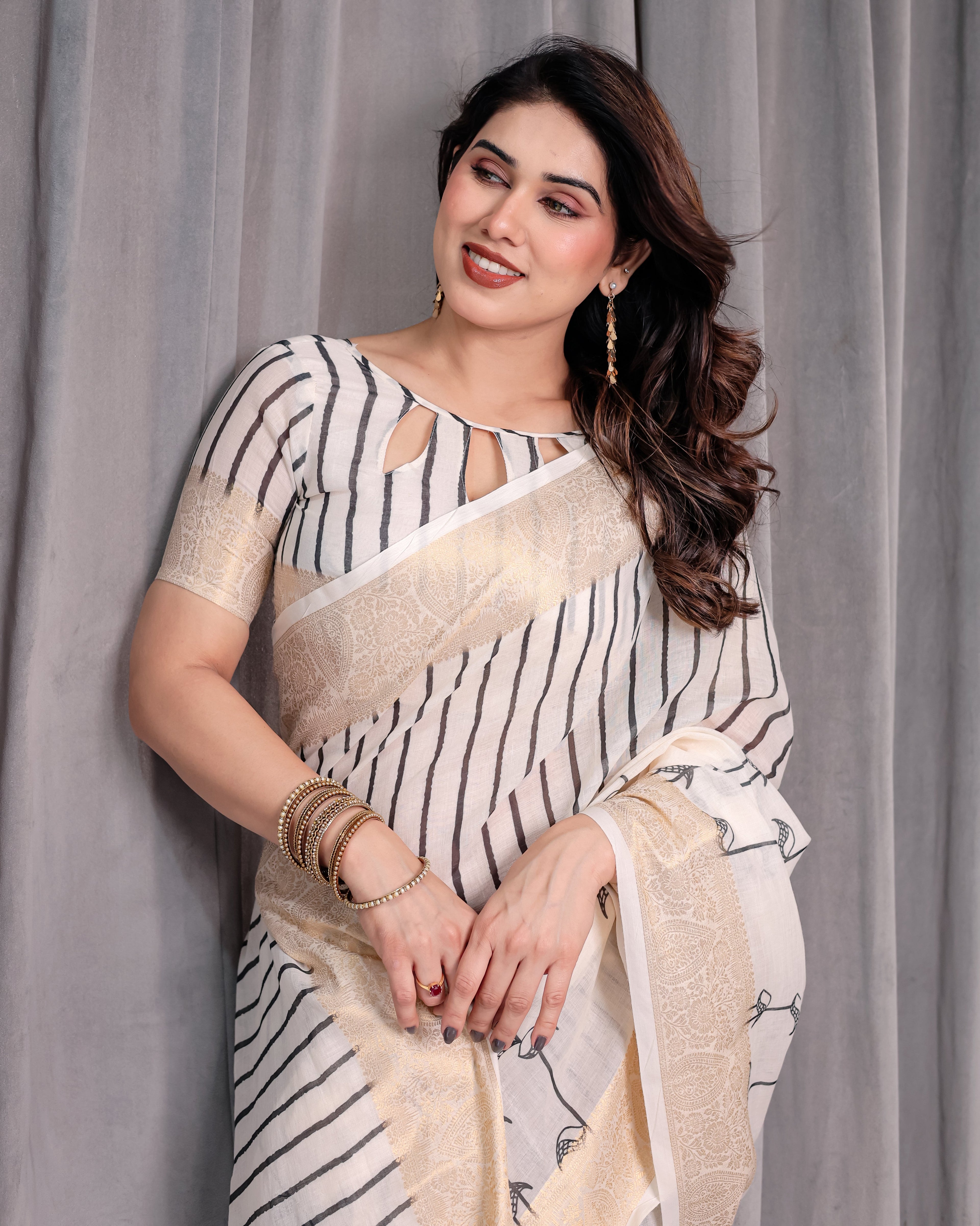 Off-White Handloom Linen Saree with Black Vertical Stripes & Tribal Motifs | Golden Zari Border & Tassel Pallu | Attached Blouse | 5.5m Saree + 0.8m Blouse