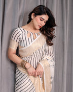 Off-White Handloom Linen Saree with Black Vertical Stripes & Tribal Motifs | Golden Zari Border & Tassel Pallu | Attached Blouse | 5.5m Saree + 0.8m Blouse