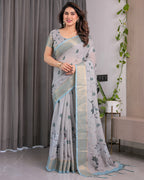 Elegant Ice Grey Handloom Linen Saree with Floral Print, Gold Zari Border & Tassel Detailing | Attached Blouse Piece | 5.5m Saree + 0.8m Blouse