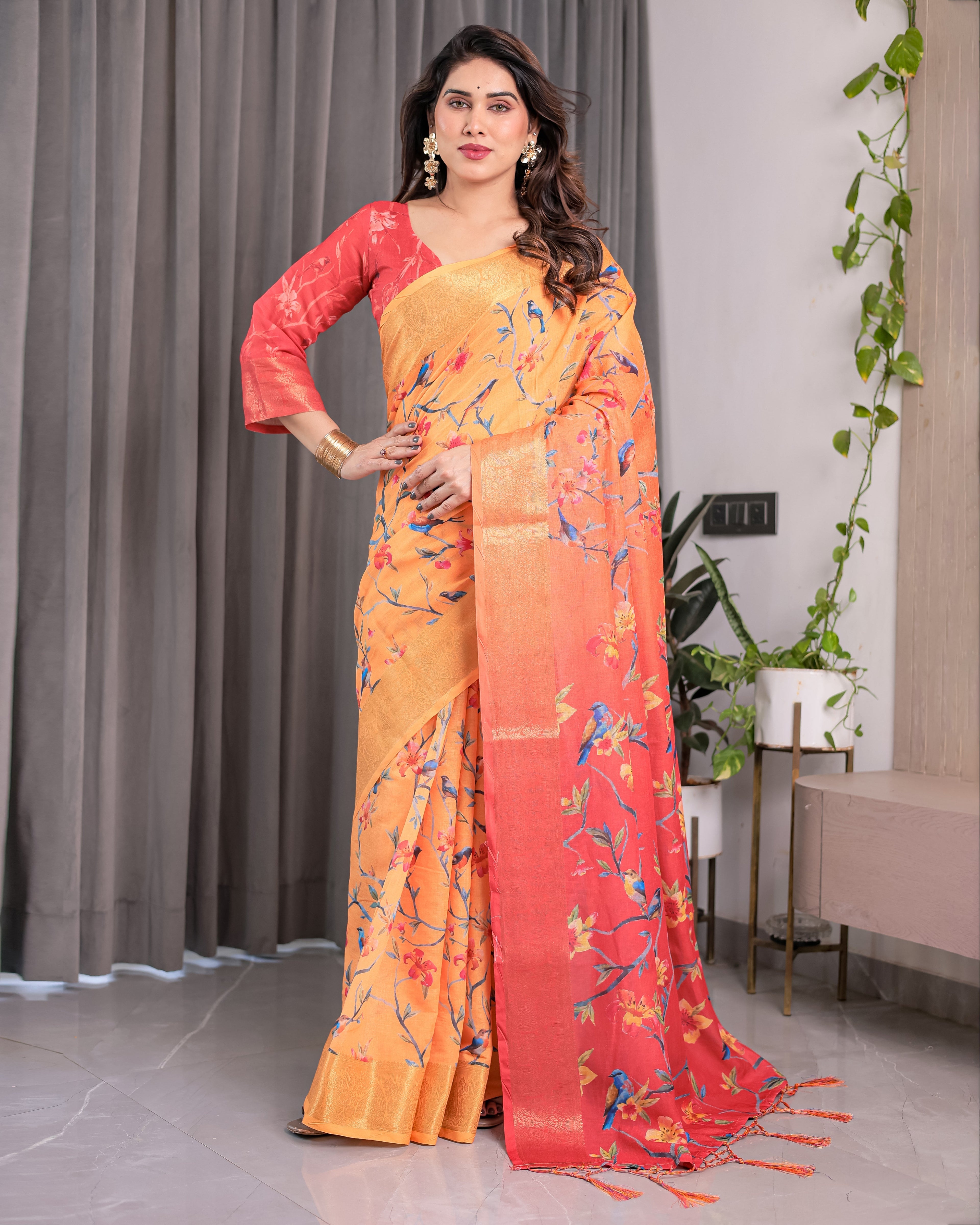 Sunset Orange Handloom Linen Saree with Bluebird & Floral Digital Print | Contrasting Red Pallu & Gold Zari Border | Tassel Detailing | Attached Blouse | 5.5m Saree + 0.8m Blouse