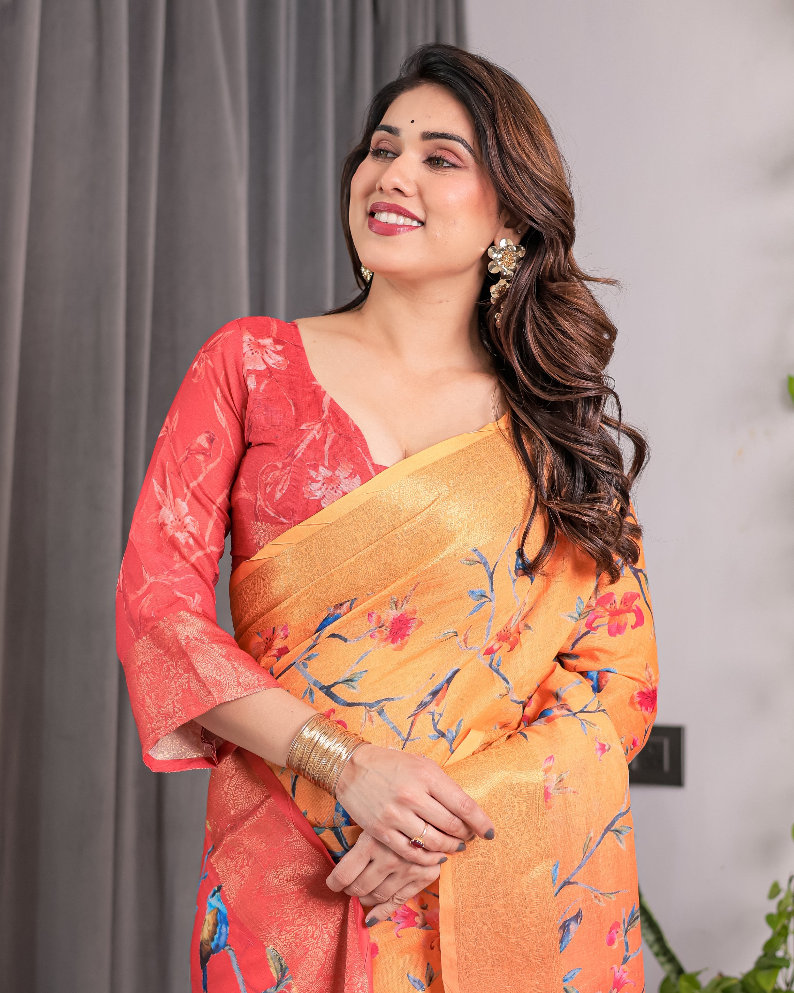 Sunset Orange Handloom Linen Saree with Bluebird & Floral Digital Print | Contrasting Red Pallu & Gold Zari Border | Tassel Detailing | Attached Blouse | 5.5m Saree + 0.8m Blouse