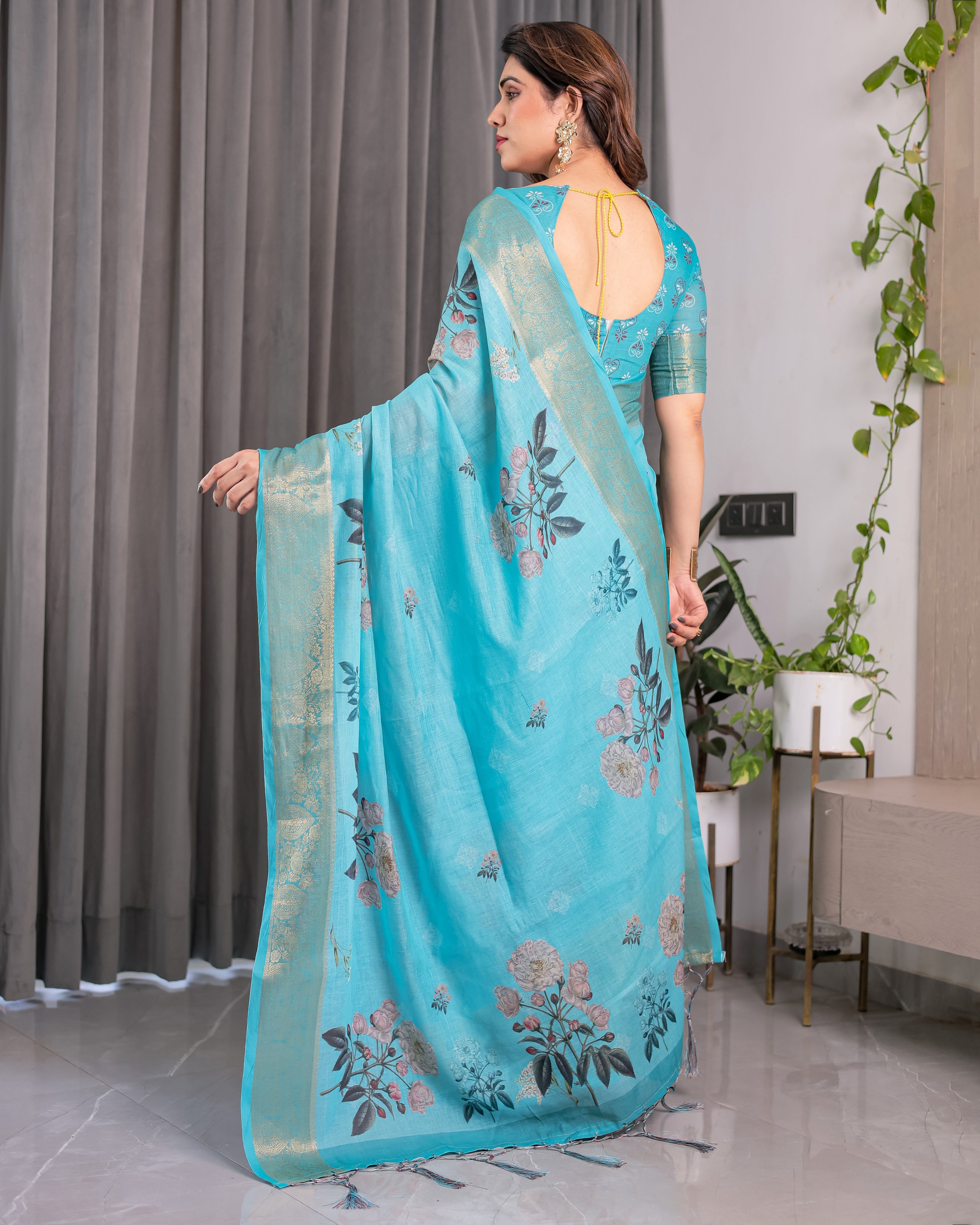 Turquoise Blue Handloom Linen Saree with Floral Digital Print & Golden Zari Border | Tassel Detailing | Attached Blouse | 5.5m Saree + 0.8m Blouse