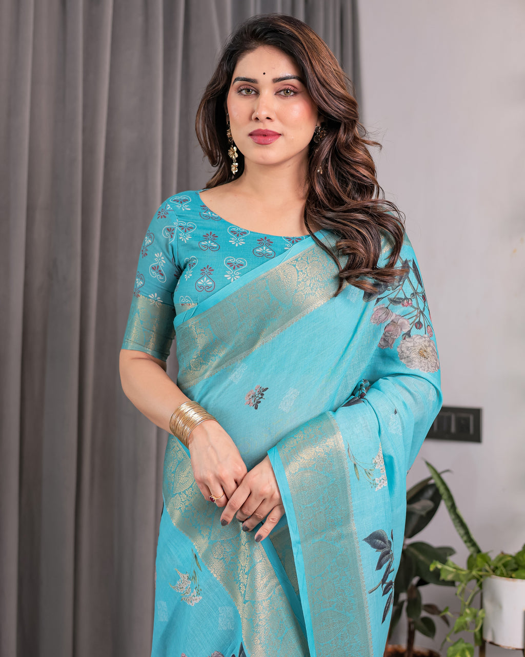 Turquoise Blue Handloom Linen Saree with Floral Digital Print & Golden Zari Border | Tassel Detailing | Attached Blouse | 5.5m Saree + 0.8m Blouse
